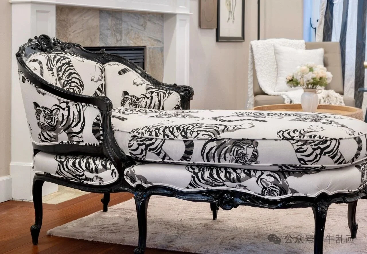Vintage chaise lounge upholstered in black-and-white tiger print fabric