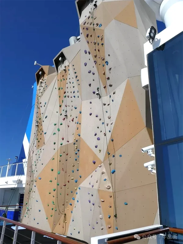 The rock climbing wall against a blue sky