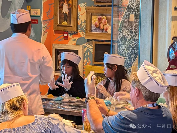 Kids in paper chef hats at a cake decorating class