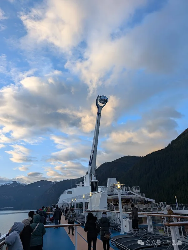 The North Star pod raised high on its arm above the deck at dusk