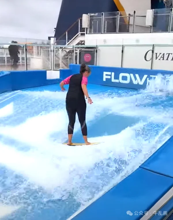 A passenger riding the FlowRider surf simulator