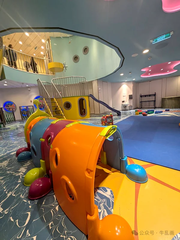 The colorful toddler play area with tunnels and slides