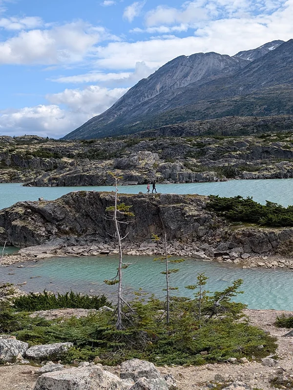 Turquoise lakes and rocky bluffs on the road from Skagway toward the Yukon